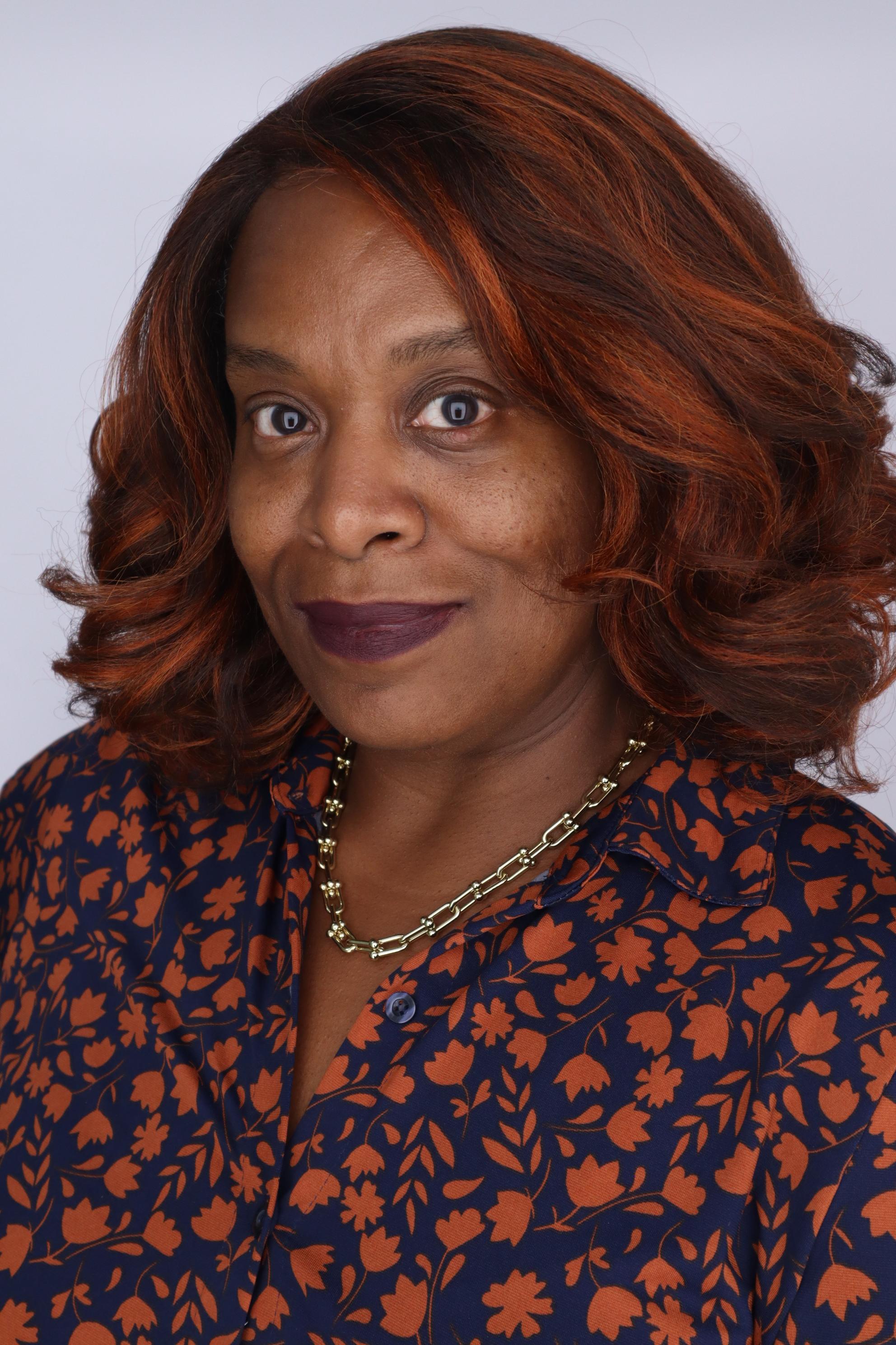 LT Robinson professional headshot with a light grey background
